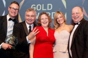 Picture of the Moller team collecting their third gold M&IT award