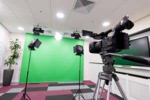 Close up of recording camera with greenscreen in background
