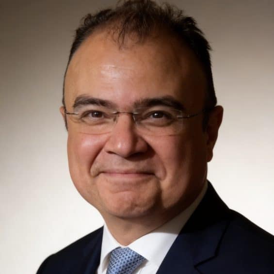 Dr Hisham Abdel Rahman, he has glasses and short dark hair