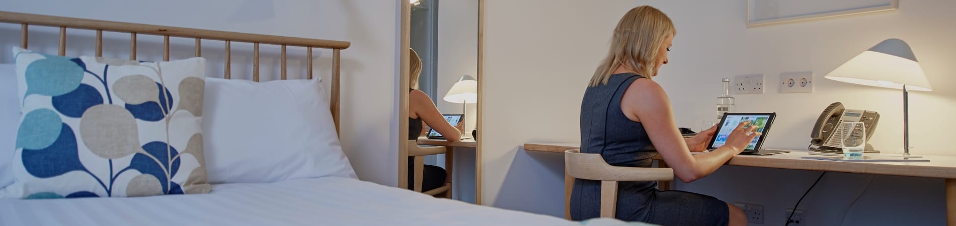 Female delegate in a bedroom at Moller Institute Picture of a female delegate in a bedroom at Moller Institute