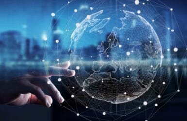 Global leadership Picture of a hand touching a digital globe - foreign direct investment programme