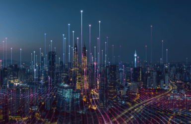 Igniting Innovation for Impact programme image Picture of a city skyline at night with lights