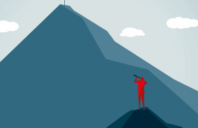 Picture of a man looking up a mountain